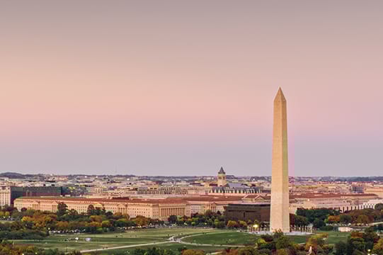 Aerial shot of the Washington Monument and the National Mall in Washington, D.C. at sunset on a clear evening in Fall. (Credit: halbergman via Getty Images)